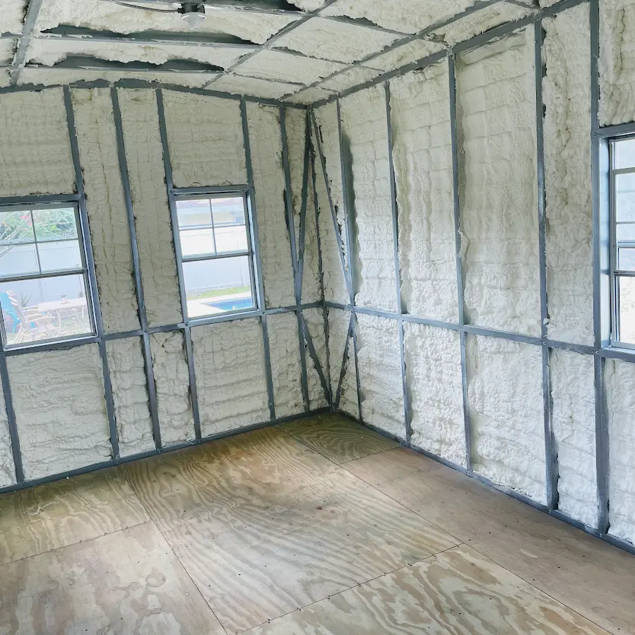 Closed-cell spray foam insulation applied to wall cavities in a residential project in Plumsted